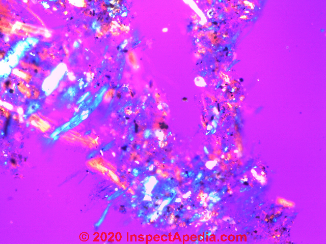 TEM photograph of 20% Chrysotile asbestos in a rectangular chip resilient flooring sample from a 1960s northern Minnesota home (C) Daniel Friedman at InspectApedia.com w/ EMS Lab